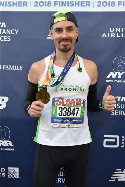 Photo with my 2018 NYC Marathon Medal
